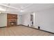 Cozy living room showcasing a brick fireplace and neutral tile flooring at 1334 Jennie Sw Ln, Lilburn, GA 30047