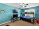 bedroom with blue walls, bunk bed, TV set up and lots of light at 15 Glen Echo Dr, Covington, GA 30016