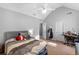 Bright bedroom featuring vaulted ceilings, ceiling fan, and a cozy bed at 15 Glen Echo Dr, Covington, GA 30016