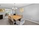 Elegant dining room featuring neutral walls, a chandelier, and seating for eight at 15 Glen Echo Dr, Covington, GA 30016