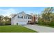 Traditional two-story home with a spacious front lawn and a long driveway at 15 Glen Echo Dr, Covington, GA 30016