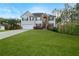 Charming two-story home with a well-manicured lawn and inviting curb appeal at 15 Glen Echo Dr, Covington, GA 30016