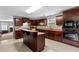 Gourmet kitchen with a cooktop, built in oven, and center island with extra seating at 15 Glen Echo Dr, Covington, GA 30016