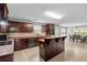 Spacious kitchen with an island, stainless steel appliances, and tile flooring at 15 Glen Echo Dr, Covington, GA 30016