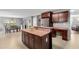 Open-concept kitchen featuring a breakfast bar, adjacent dining area, and modern finishes at 15 Glen Echo Dr, Covington, GA 30016
