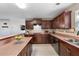 Inviting kitchen boasts granite countertops, stainless appliances, and ample cabinet space at 15 Glen Echo Dr, Covington, GA 30016