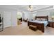 Bright and airy main bedroom featuring tray ceilings, neutral colors, and a large window allowing for ample natural light at 15 Glen Echo Dr, Covington, GA 30016