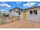 Backyard featuring a wooden deck and yellow backdoor at 3632 Glen Mora Drive, Decatur, GA 30032