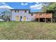 Expansive backyard featuring a large deck and modern home with bright yellow doors at 3632 Glen Mora Drive, Decatur, GA 30032