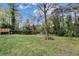 Spacious backyard featuring a large deck and wooded views at 3632 Glen Mora Drive, Decatur, GA 30032