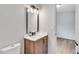 Bathroom showcasing a modern vanity with dark bronze fixtures and access door to the bedroom at 3632 Glen Mora Drive, Decatur, GA 30032