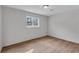 This bedroom features hardwood floors, neutral paint, and a window providing natural light at 3632 Glen Mora Drive, Decatur, GA 30032