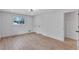 Bedroom features hardwood floors, a light fixture, and a window with views of the outdoors at 3632 Glen Mora Drive, Decatur, GA 30032