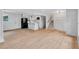 Open-concept living space with new floors, black appliances and modern fixtures at 3632 Glen Mora Drive, Decatur, GA 30032