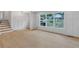 Bright living space showcasing craftsman style trim, new floors and large windows at 3632 Glen Mora Drive, Decatur, GA 30032