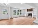 Bright living room with a fireplace and built-in shelves and large windows at 3632 Glen Mora Drive, Decatur, GA 30032