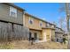 Fenced backyard with table and chairs, patio area, and exterior home elevation at 2728 Keystone Gates Ct, Lithonia, GA 30058