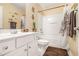 Bathroom featuring a vanity sink with crystal knobs, a toilet, and a shower with a shower curtain at 2728 Keystone Gates Ct, Lithonia, GA 30058