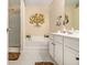 Bright bathroom with a soaking tub and glass enclosed shower at 2728 Keystone Gates Ct, Lithonia, GA 30058