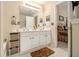 Bathroom featuring double vanity, built in cabinet, and doorway to bedroom at 2728 Keystone Gates Ct, Lithonia, GA 30058