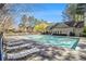 View of the Keystone Gates community pool featuring a sundeck, lounge chairs and tables at 2728 Keystone Gates Ct, Lithonia, GA 30058