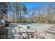 Keystone Gates community pool with lounge chairs and tables for residents' enjoyment at 2728 Keystone Gates Ct, Lithonia, GA 30058