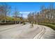 Keystone Gates Entrance with a view into the community surrounded by mature trees at 2728 Keystone Gates Ct, Lithonia, GA 30058