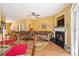 Inviting living space adjacent to dining area with fireplace and lots of natural light at 2728 Keystone Gates Ct, Lithonia, GA 30058