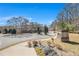 Exterior street view of Keystone Gates townhome community entrance with landscaping at 2728 Keystone Gates Ct, Lithonia, GA 30058