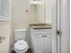 Cozy bathroom featuring modern vanity, granite countertop, and toilet at 6510 Hazel St, Lithia Springs, GA 30122