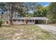 Charming one-story home with a cozy carport and red front door entrance at 6510 Hazel St, Lithia Springs, GA 30122
