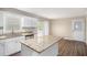 Spacious kitchen featuring white cabinets, granite countertops, and stainless steel dishwasher at 6510 Hazel St, Lithia Springs, GA 30122