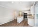 Bright kitchen featuring white cabinets, stainless steel appliances, and granite countertops at 6510 Hazel St, Lithia Springs, GA 30122