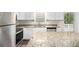 Bright kitchen featuring granite countertops, stainless steel appliances, and access to the deck at 6510 Hazel St, Lithia Springs, GA 30122