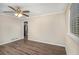 Spacious living room with hardwood floors and an opening to the kitchen at 6510 Hazel St, Lithia Springs, GA 30122