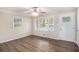 Cozy living room with hardwood floors and natural light streaming through the windows at 6510 Hazel St, Lithia Springs, GA 30122