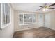Bright living room featuring hardwood floors, large windows, and neutral paint at 6510 Hazel St, Lithia Springs, GA 30122