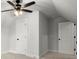 Bedroom with a ceiling fan, plush carpet, and closet space, perfect for comfortable living at 5010 Hyde Way, Cumming, GA 30040