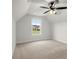 Cozy bedroom with plush carpet, ceiling fan and natural light coming through the window at 5010 Hyde Way, Cumming, GA 30040