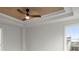 Stylish bedroom featuring wood-look ceiling accent, fan, and plush carpeting throughout at 5010 Hyde Way, Cumming, GA 30040