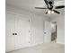 Spacious bedroom with a ceiling fan, plush carpet and closet for ample storage space at 5010 Hyde Way, Cumming, GA 30040