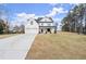 Stunning two-story home with a manicured lawn, two-car garage and a welcoming facade at 5010 Hyde Way, Cumming, GA 30040
