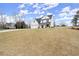 Two-story home with lush yard and a long driveway at 5010 Hyde Way, Cumming, GA 30040