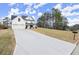 Spacious two-story home with attached two-car garage and a long driveway at 5010 Hyde Way, Cumming, GA 30040