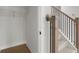 View of hallway with closet and stairway at 5010 Hyde Way, Cumming, GA 30040