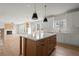 Modern kitchen with island, white cabinets, stainless steel appliances at 5010 Hyde Way, Cumming, GA 30040