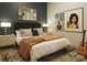 Comfortable bedroom with a cozy bed, modern artwork, and natural lighting at 567 Ponce De Leon Ne Ave # 501, Atlanta, GA 30308