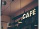 Charming cafe interior with a retro vibe, featuring pendant lights, a chalkboard menu, and cozy ambiance at 567 Ponce De Leon Ne Ave # 501, Atlanta, GA 30308