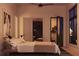 Serene bedroom featuring a comfortable bed, modern decor, and city skyline view at 567 Ponce De Leon Ne Ave # 501, Atlanta, GA 30308