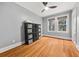 Bright bedroom featuring hardwood floors, neutral walls, ceiling fan and two windows at 1040 Amsterdam Ne Ave, Atlanta, GA 30306